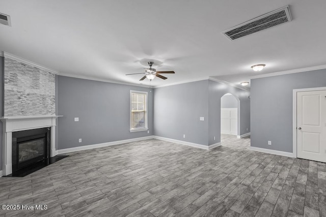 unfurnished living room featuring ornamental molding, light hardwood / wood-style floors, and ceiling fan