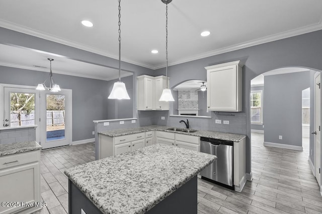 kitchen with white cabinetry, dishwasher, a center island, and sink