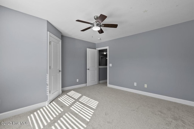 unfurnished bedroom with light colored carpet and ceiling fan