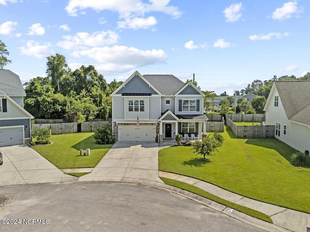 craftsman house featuring a garage, a front lawn, and covered porch