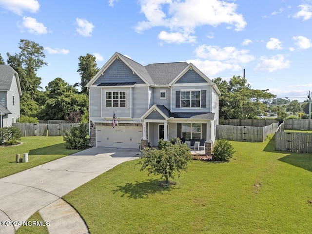 craftsman-style home featuring a garage, covered porch, and a front lawn