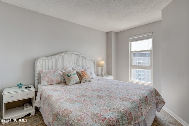 bedroom featuring a textured ceiling