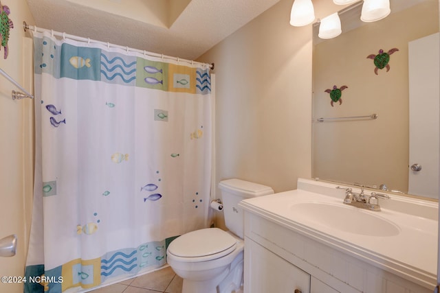 bathroom with vanity, tile patterned floors, a textured ceiling, and toilet