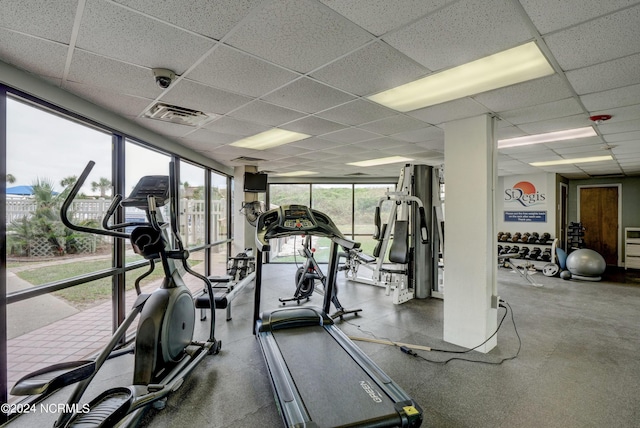 gym featuring a paneled ceiling