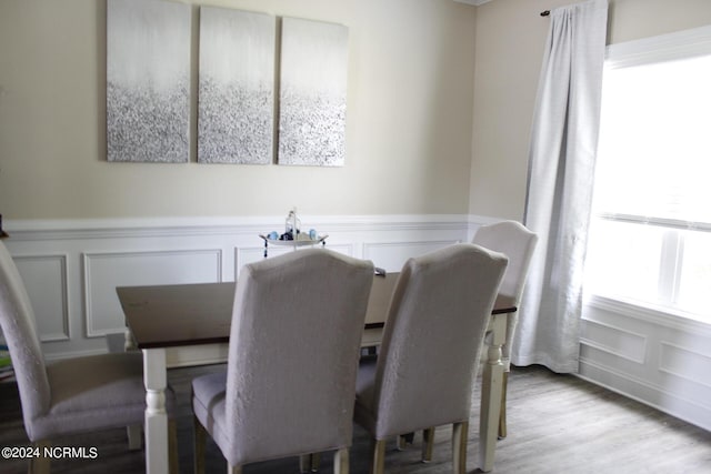 dining space with light hardwood / wood-style floors