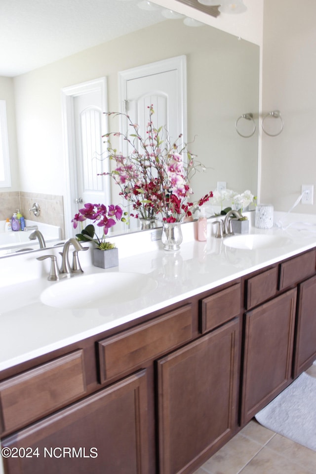 bathroom with tile patterned floors and vanity