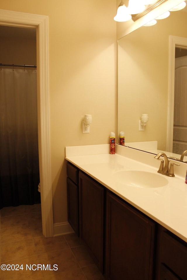 bathroom featuring tile patterned flooring and vanity