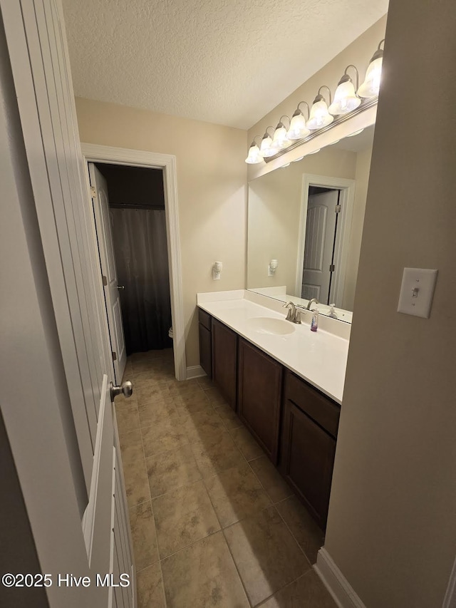 206 Messenger Ct, Jacksonville, NC 28546 - full bathroom featuring vanity, tile patterned flooring, a textured ceiling, a shower with shower curtain, and toilet