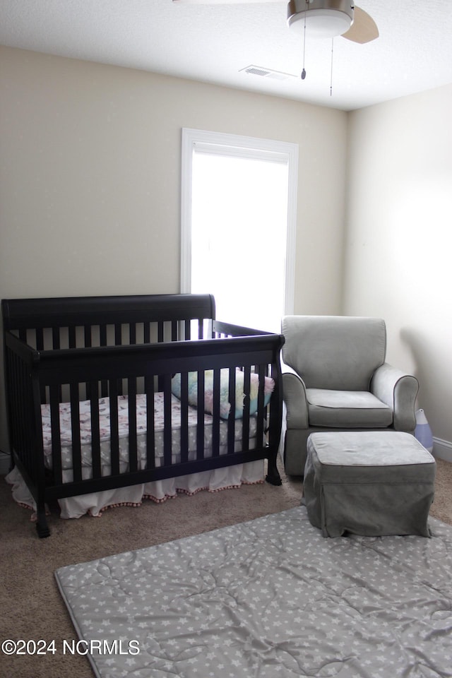 bedroom featuring carpet floors and visible vents