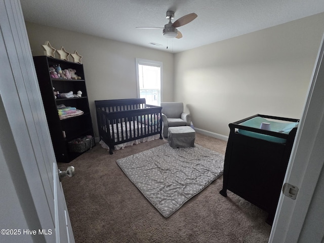 206 Messenger Ct, Jacksonville, NC 28546 - bedroom with carpet, a textured ceiling, a ceiling fan, and a nursery area