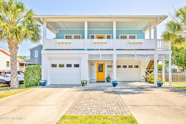 view of front of house featuring a balcony and a garage