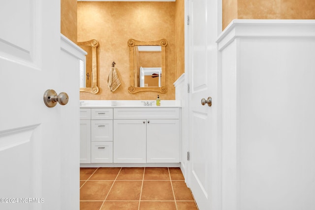 bathroom with tile patterned flooring and vanity