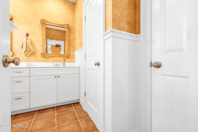 bathroom featuring tile patterned flooring and vanity