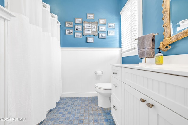 bathroom with vanity and toilet