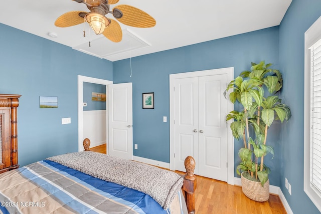 bedroom with a closet, ceiling fan, and hardwood / wood-style flooring