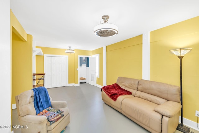 living room with concrete flooring