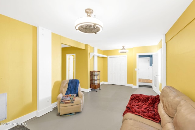 living room featuring concrete flooring