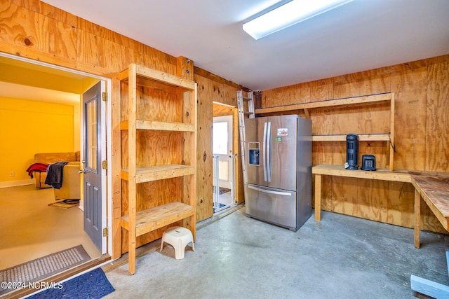 misc room featuring wooden walls