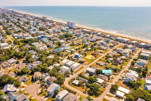 aerial view featuring a water view and a beach view