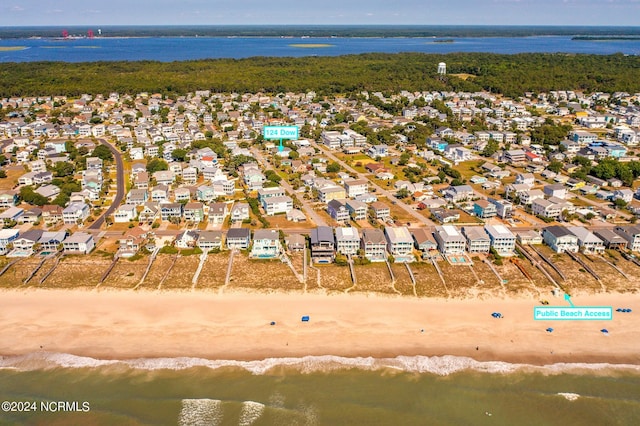 aerial view featuring a water view and a beach view