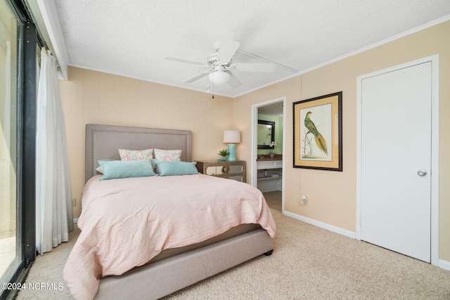 bedroom with ornamental molding, light carpet, and a textured ceiling