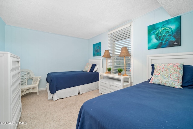 carpeted bedroom featuring a textured ceiling