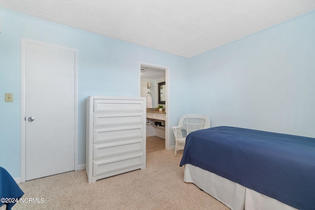 carpeted bedroom with a textured ceiling