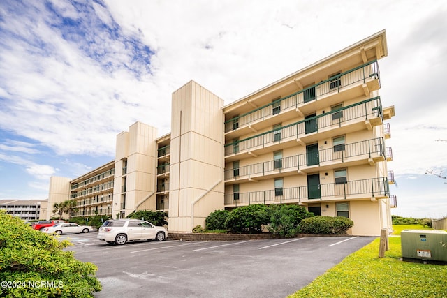 2305 W Fort Macon Rd Unit 107, Atlantic Beach, NC 28512 - view of apartment building / complex featuring uncovered parking