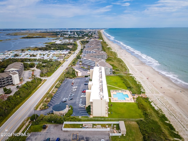 bird's eye view featuring a view of the beach and a water view