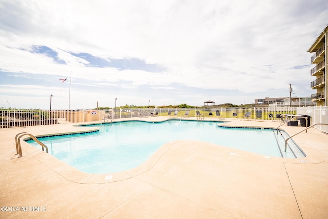 view of pool featuring a patio area