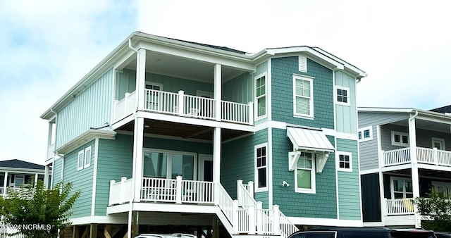 rear view of house featuring board and batten siding