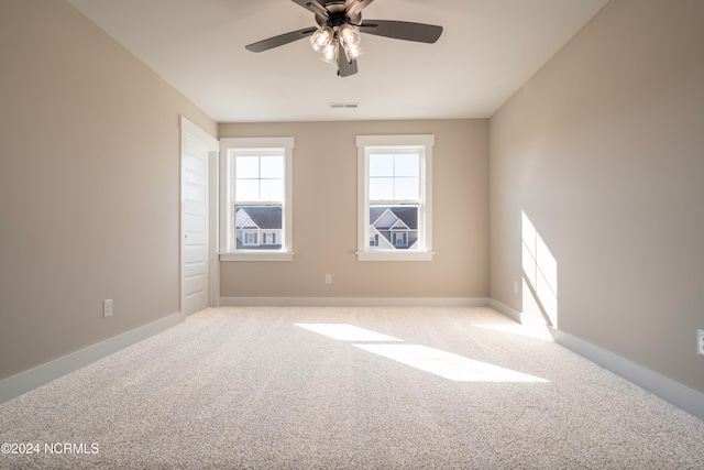 carpeted empty room with ceiling fan