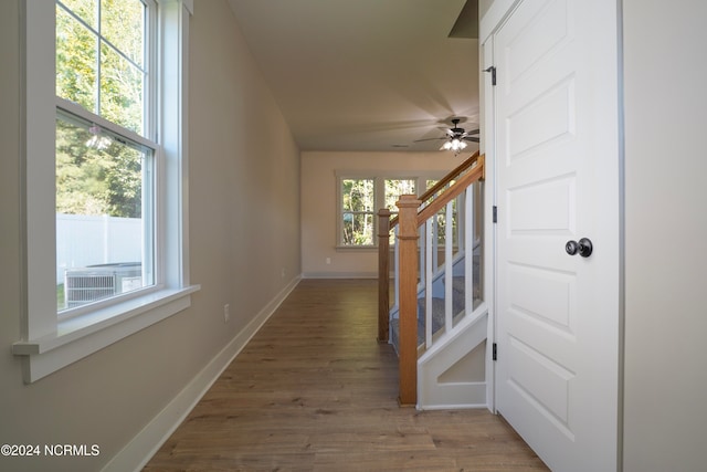 hall with hardwood / wood-style flooring