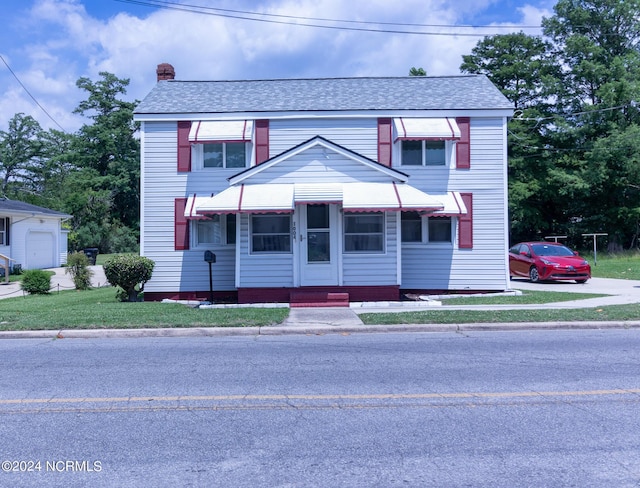 view of front of house with a front lawn