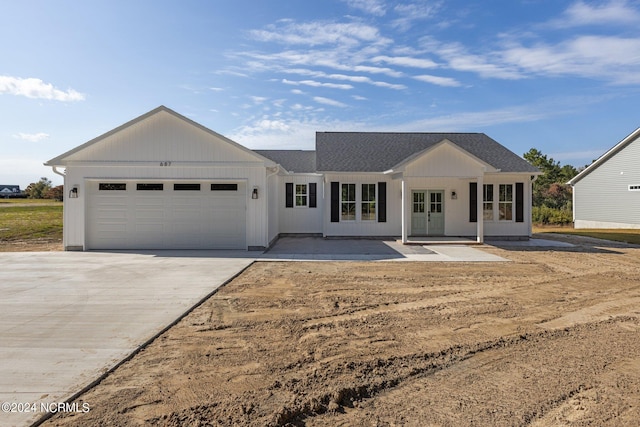 ranch-style home featuring a garage