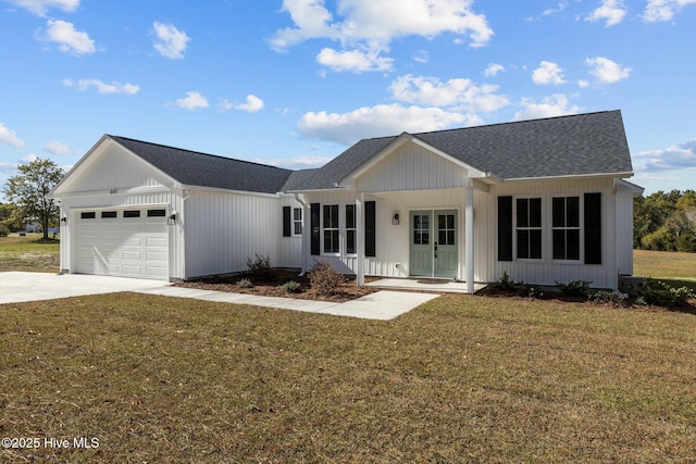 ranch-style house with a garage, covered porch, and a front lawn