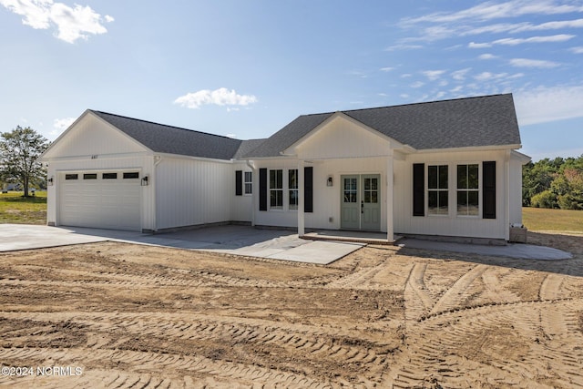 ranch-style house featuring a garage