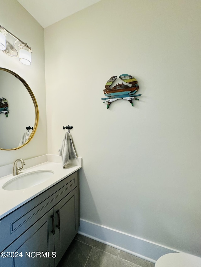 bathroom with tile patterned flooring and vanity