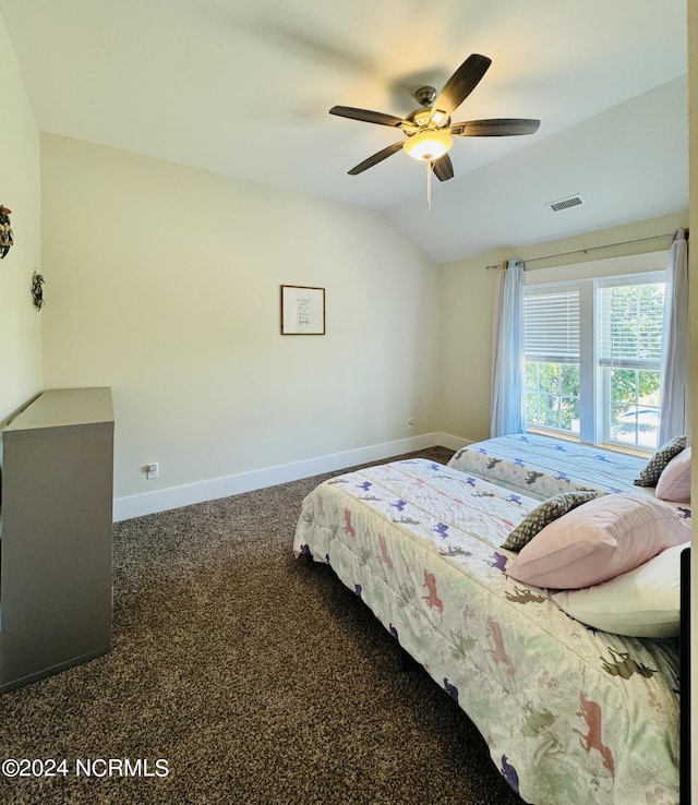 carpeted bedroom with ceiling fan and lofted ceiling