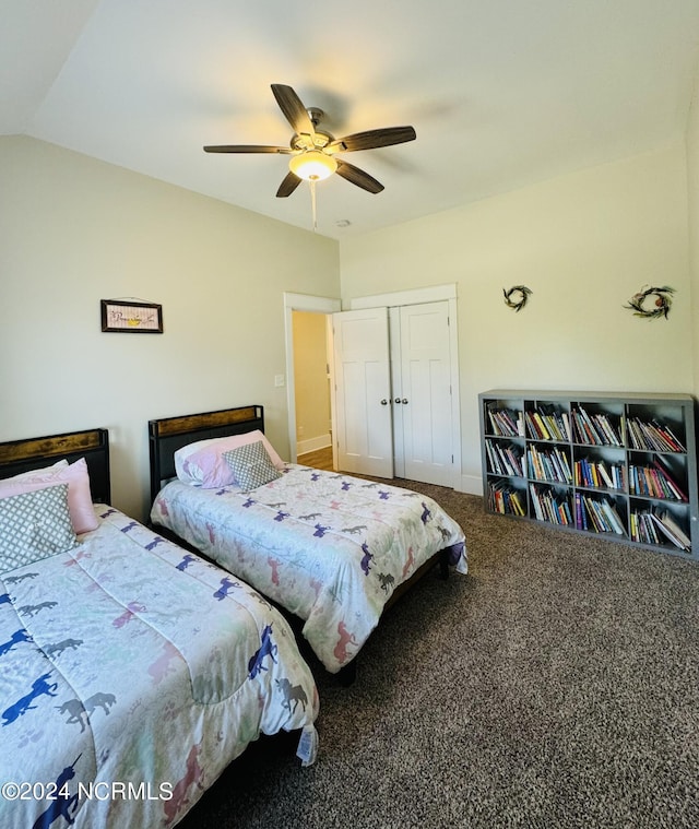 bedroom featuring carpet flooring, ceiling fan, a closet, and vaulted ceiling