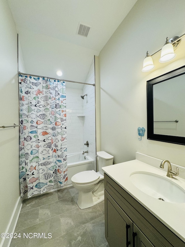 full bathroom featuring tile patterned flooring, shower / tub combo with curtain, vanity, and toilet