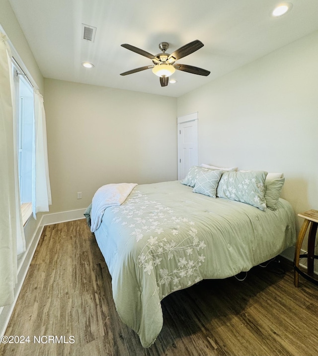 bedroom with hardwood / wood-style floors and ceiling fan