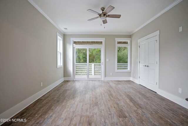 unfurnished room featuring ceiling fan, hardwood / wood-style floors, and ornamental molding