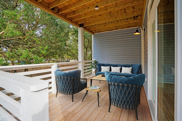 wooden terrace with outdoor lounge area