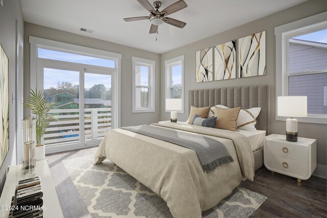 bedroom featuring access to exterior, ceiling fan, and dark hardwood / wood-style floors