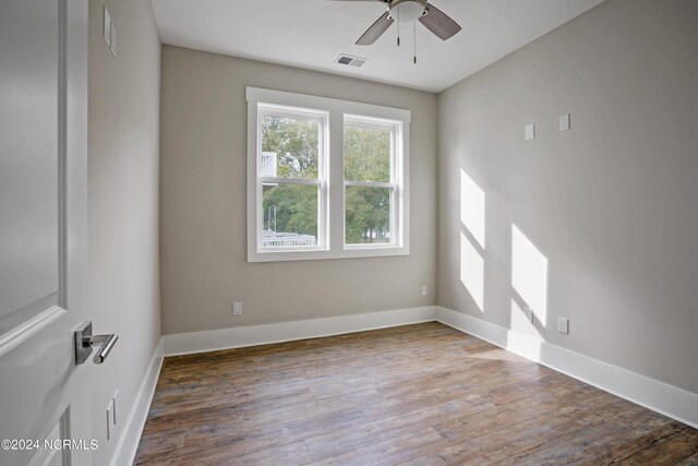 empty room with hardwood / wood-style flooring and ceiling fan