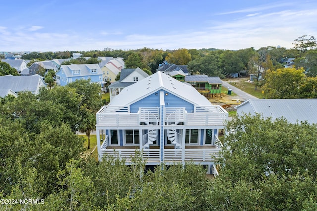 back of property with a wooden deck