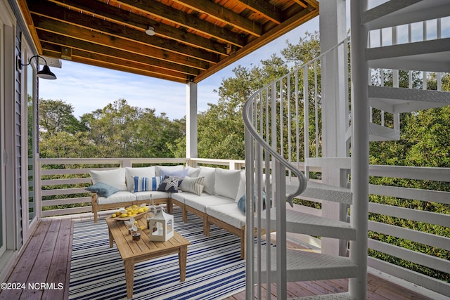 wooden terrace featuring outdoor lounge area