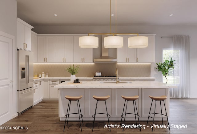 kitchen featuring a center island with sink, white cabinets, decorative light fixtures, light stone countertops, and high end fridge