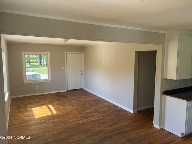 empty room with dark hardwood / wood-style floors